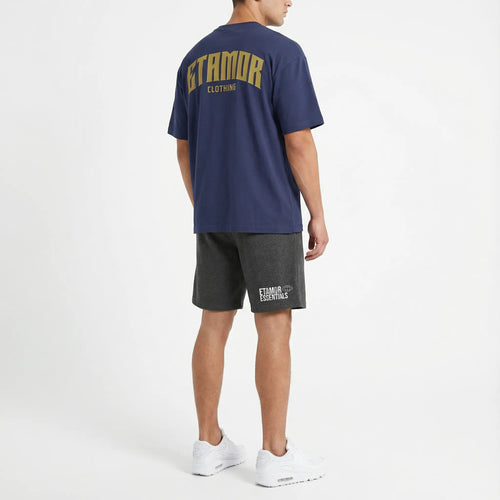 Person wearing a navy blue t-shirt and gray shorts with 'Gtamor' branding on a white background