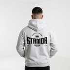 Person wearing a gray hoodie with 'ETAMOR' branding on the back against a white background