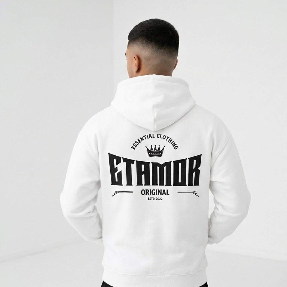 Person wearing a white hoodie with 'ETAMOR' branding on the back against a light gray background